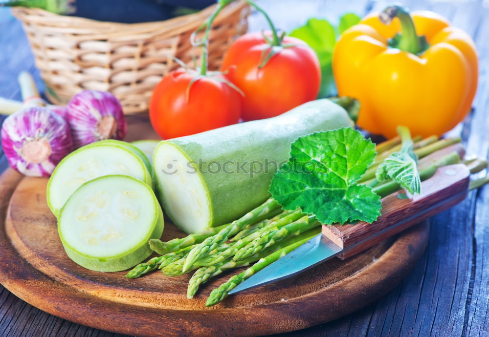 Similar – Vegetables and utensils on kitchen table