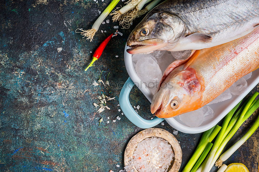 Similar – Image, Stock Photo Two Dorado fish with cooking ingredients