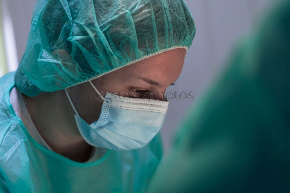 Similar – Image, Stock Photo Team of Surgeons Operating.