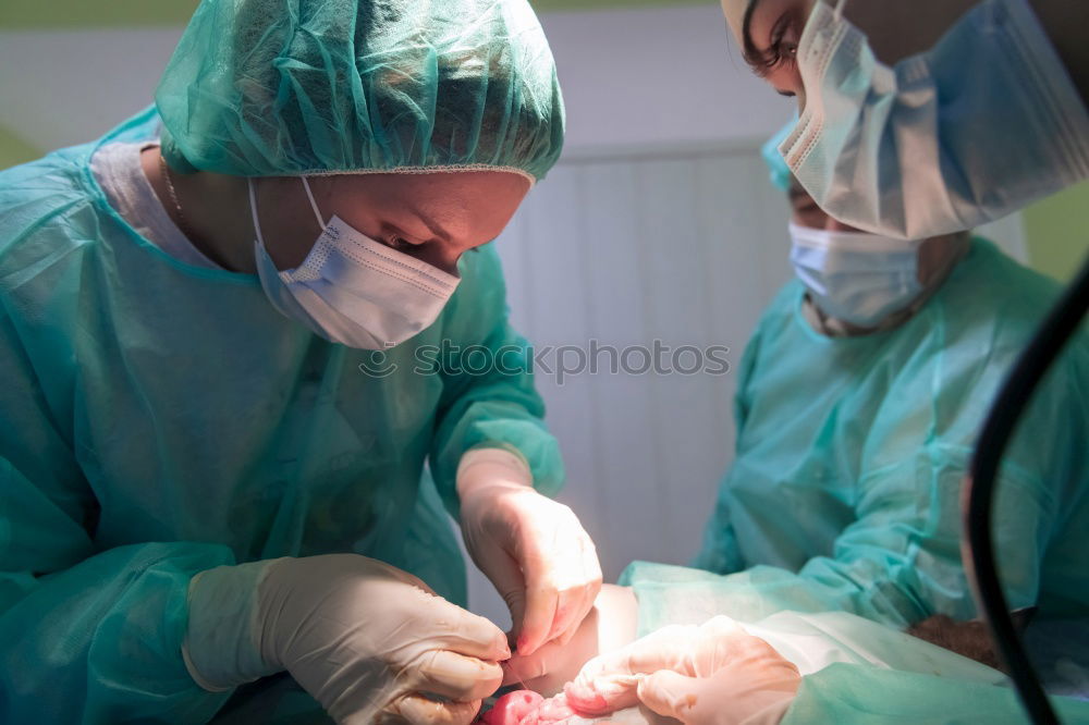Similar – Image, Stock Photo Team of Surgeons Operating.