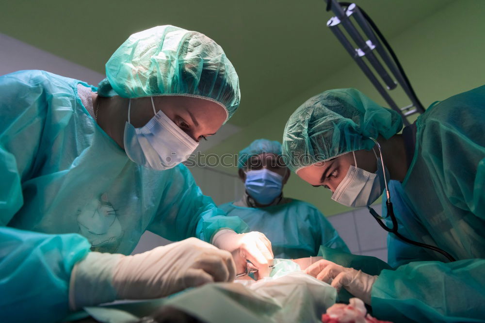 Similar – Image, Stock Photo Team of Surgeons Operating.