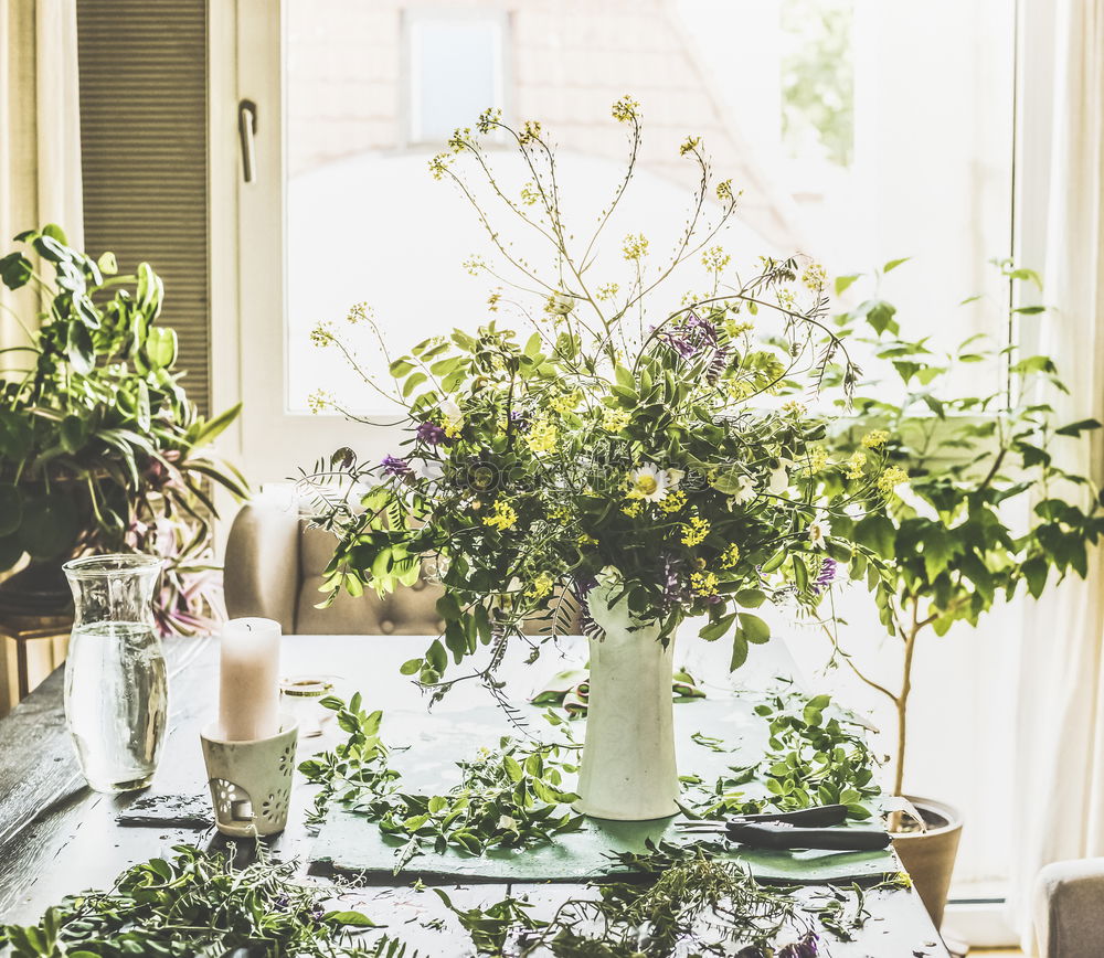 Similar – Image, Stock Photo Bouquet of flowers in a glass vase on the table in front of a window