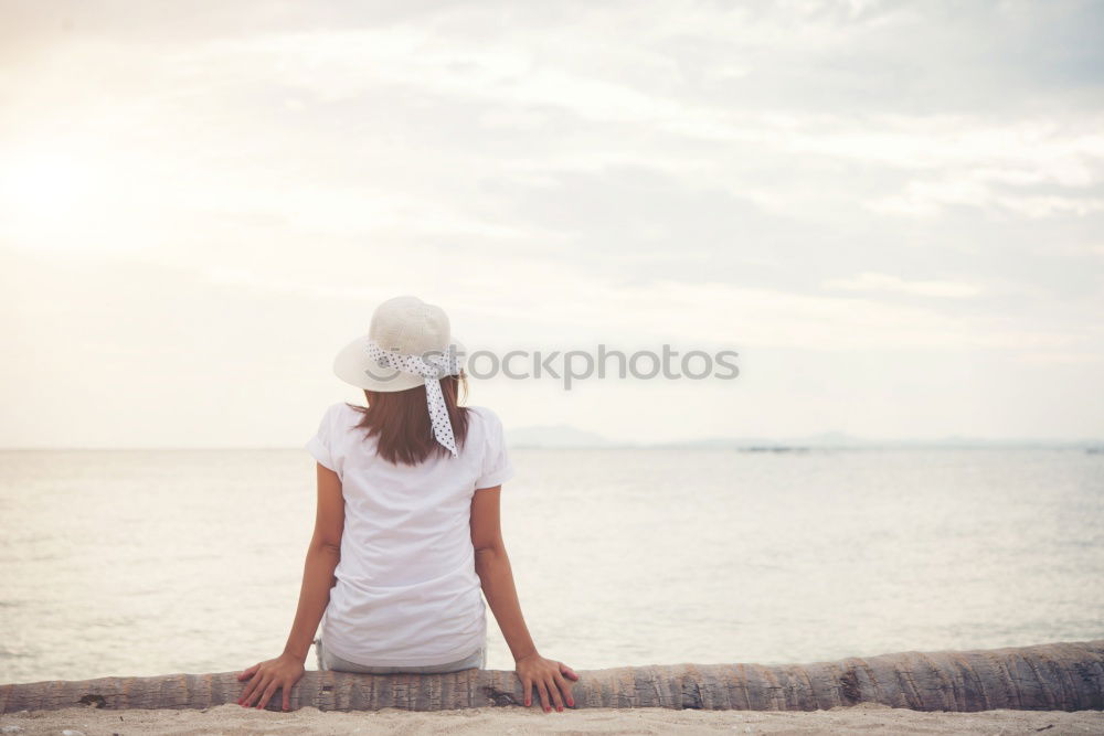 Image, Stock Photo Thoughtful child sit at waterfront. Back view