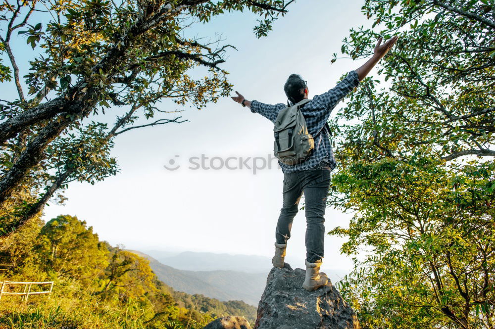 Similar – Image, Stock Photo Boy packing his clothes to backpack on trail