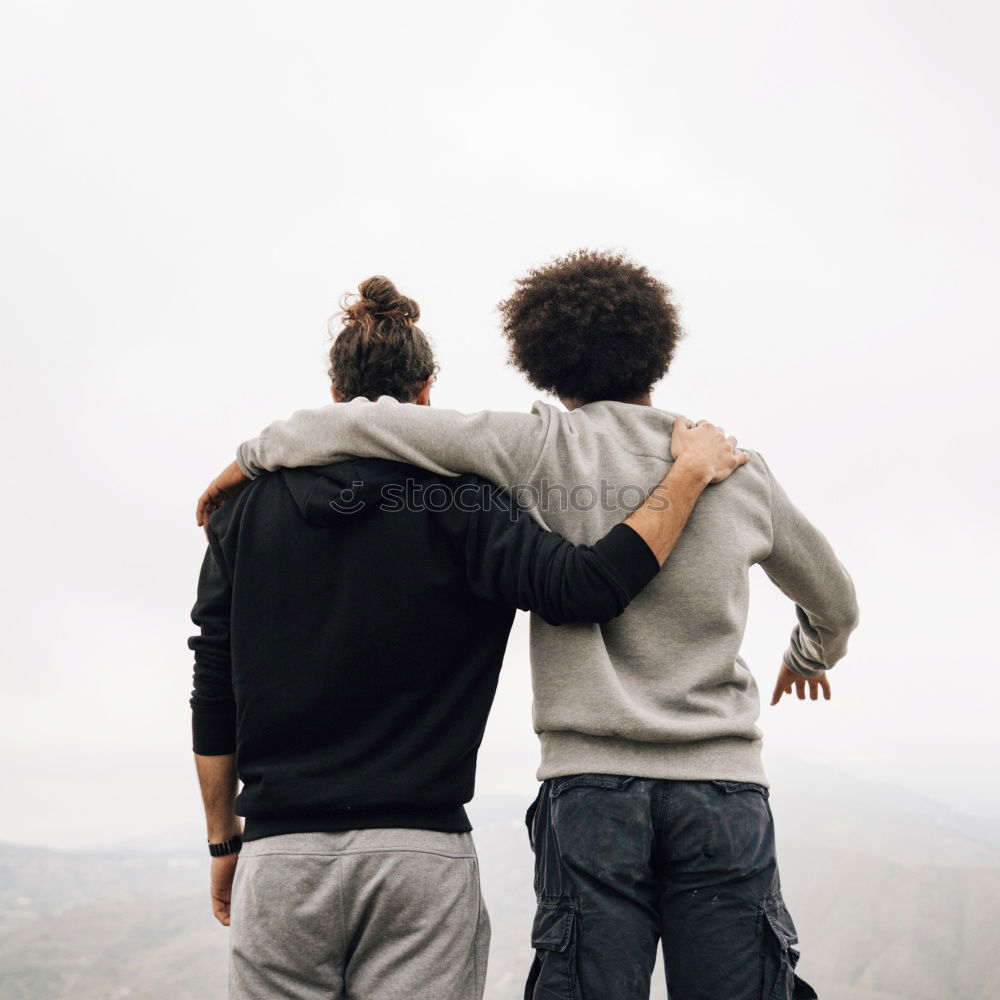 Similar – Person on cliff taking photo