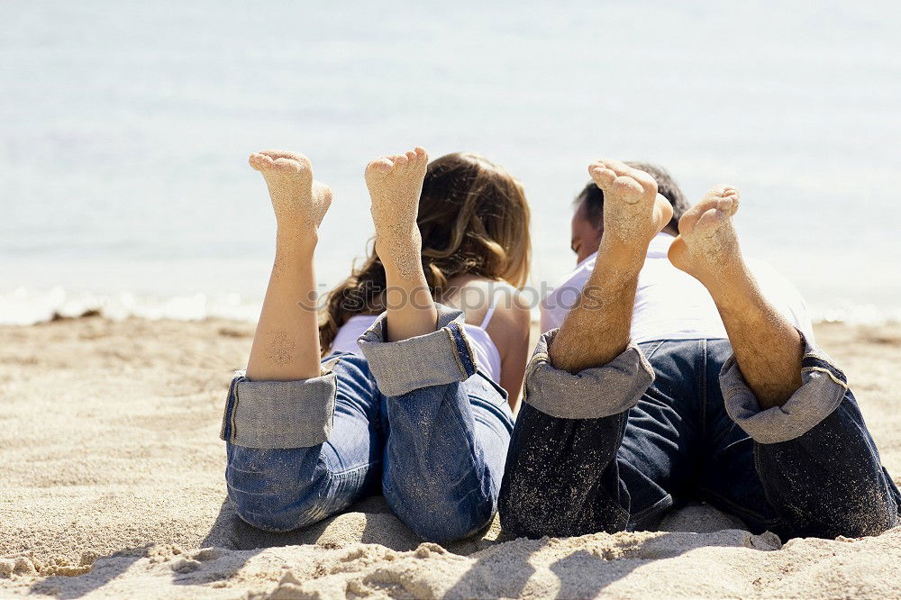 Similar – Brothers sitting at waterfront.Back view