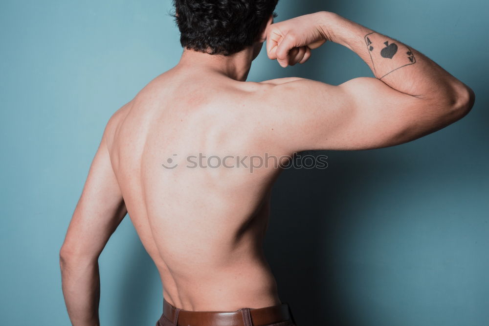 Similar – Young urban athlete warming up before calisthenics training