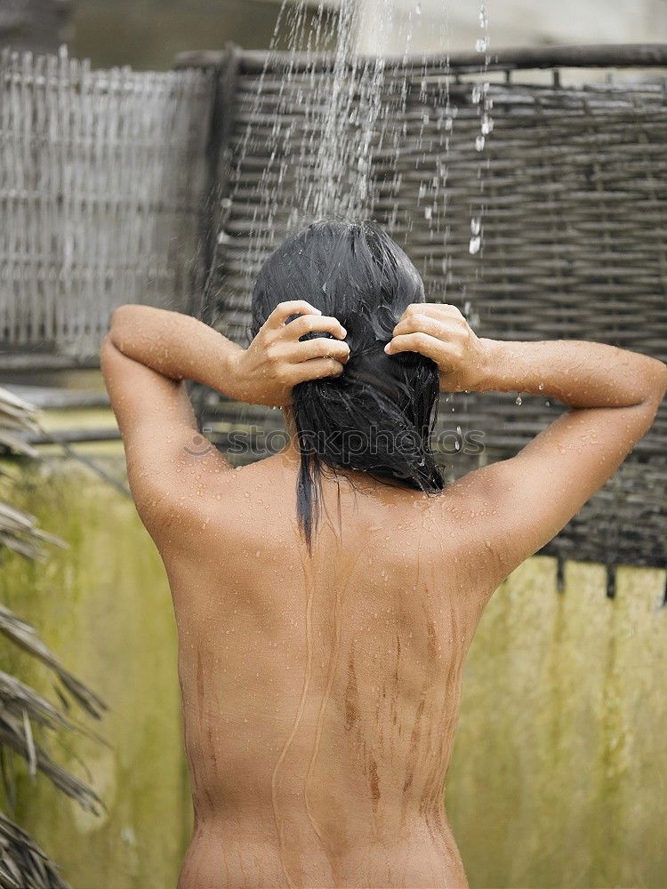 Similar – Woman using a peeling glove in a shower