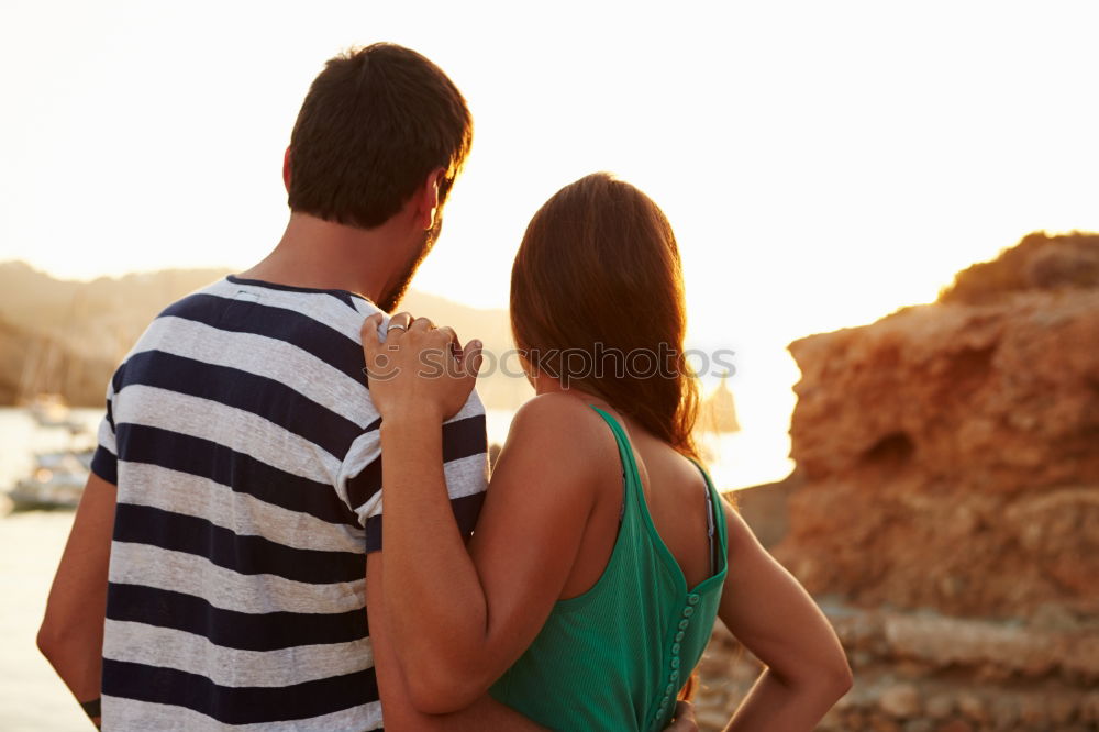 Similar – Image, Stock Photo Unrecognizable hugging couple in sunny street