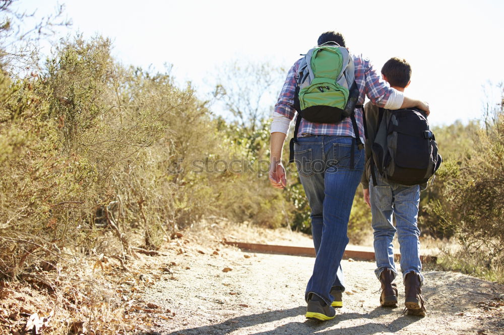 Similar – Image, Stock Photo Couple of hikers doing trekking