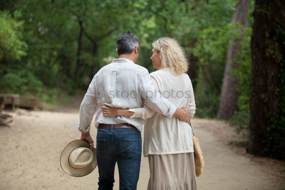 Similar – Image, Stock Photo Young smiling couple on a path in the park.