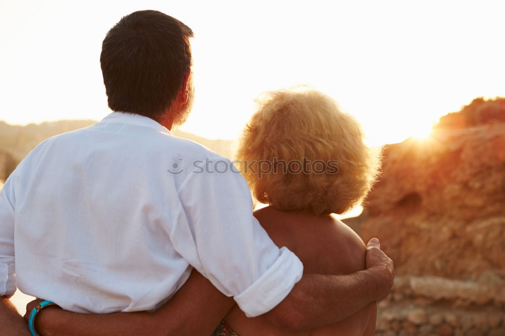 Similar – Image, Stock Photo Unrecognizable hugging couple in sunny street