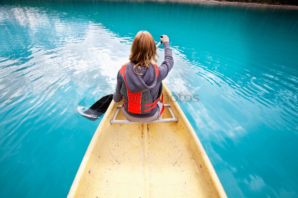 Similar – Unrecognizable woman on kayak exploring river