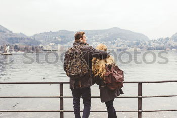 Similar – Image, Stock Photo Couple embracing on pier