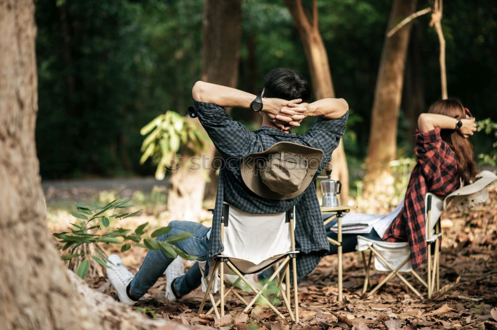 Similar – Image, Stock Photo Man in forest looking into backpack