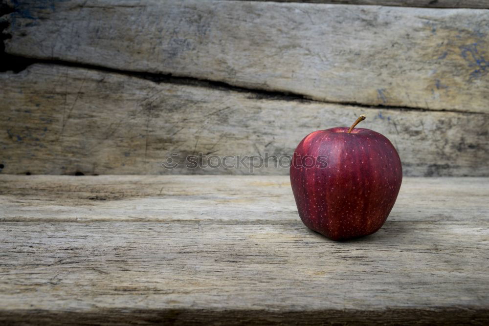 Similar – Apple on wooden floor