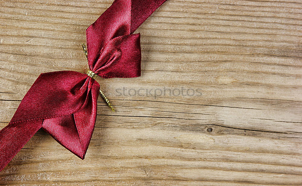 Image, Stock Photo colourful christmas parcels packed with christmas paper with red bow, on rustic wood. Christmas presents, lie nicely decorated with ribbon on wooden table. Many Christmas parcels wrapped with wrapping paper with Christmas motif. Concept gifts Advent.