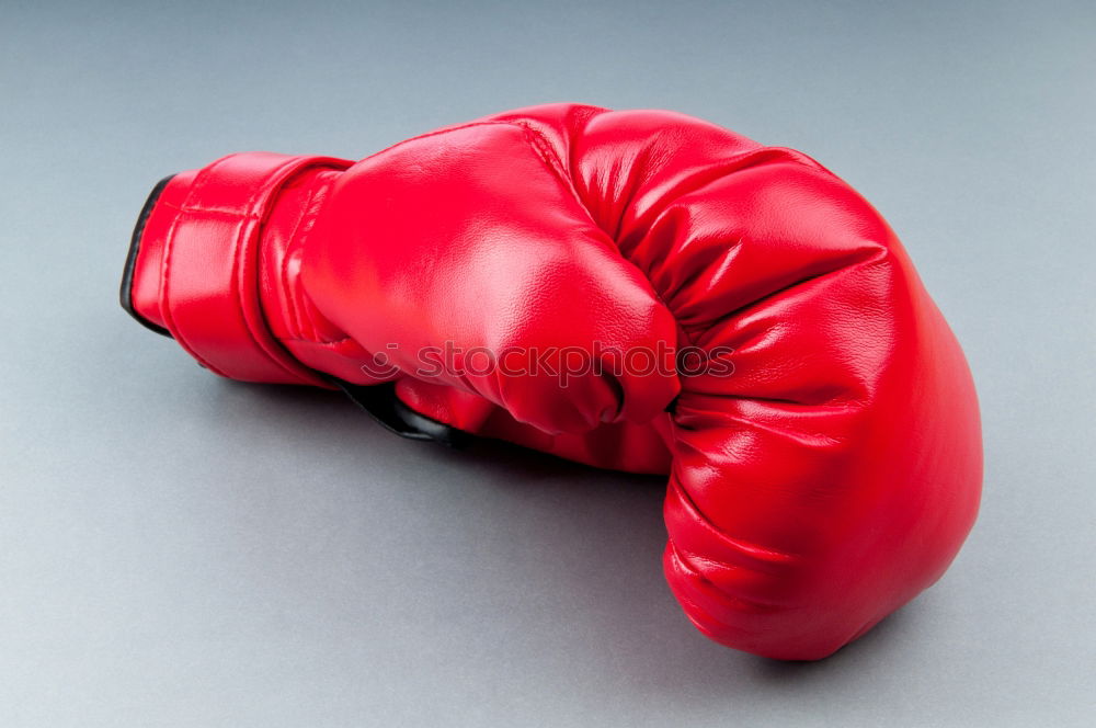 Similar – Image, Stock Photo hand is wearing a red leather boxing glove on a green background