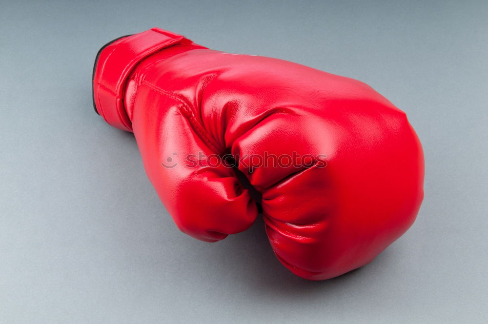 Similar – Image, Stock Photo hand is wearing a red leather boxing glove on a green background