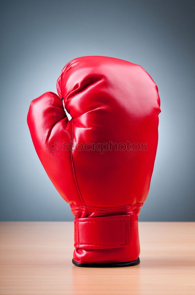 Similar – Image, Stock Photo hand is wearing a red leather boxing glove on a green background