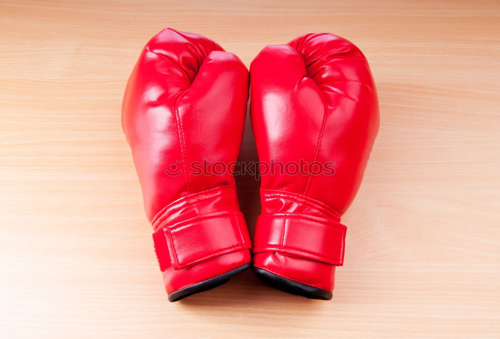 Similar – pair of red leather boxing gloves hanging on a nail