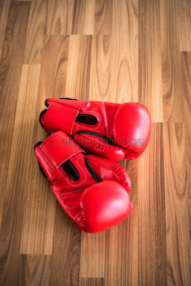 Similar – pair of red leather boxing gloves hanging on a nail