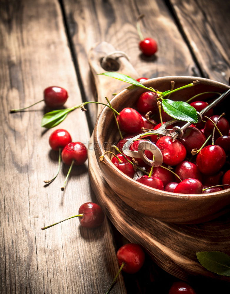 Similar – Image, Stock Photo Ripe red cherry in a paper bag