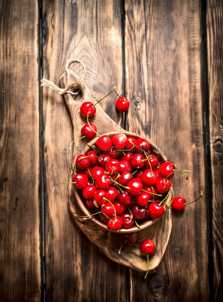 Similar – Image, Stock Photo Ripe red cherry in a paper bag