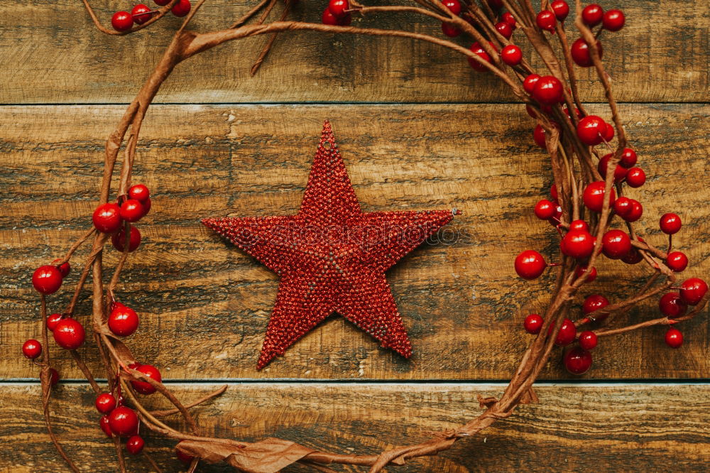 Similar – Red Christmas star with branch of berries