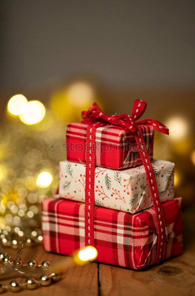 Similar – Image, Stock Photo Christmas parcel with red bow on wooden background.