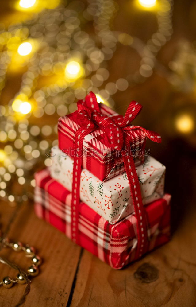 Similar – Image, Stock Photo Surprise l many, colorful, wrapped Christmas parcels & mushrooms, lying on old rustic wooden table as decoration and ornamentation. Small Christmas presents wrapped in wrapping paper with a Christmas motif are waiting to be unwrapped under the Christmas tree.