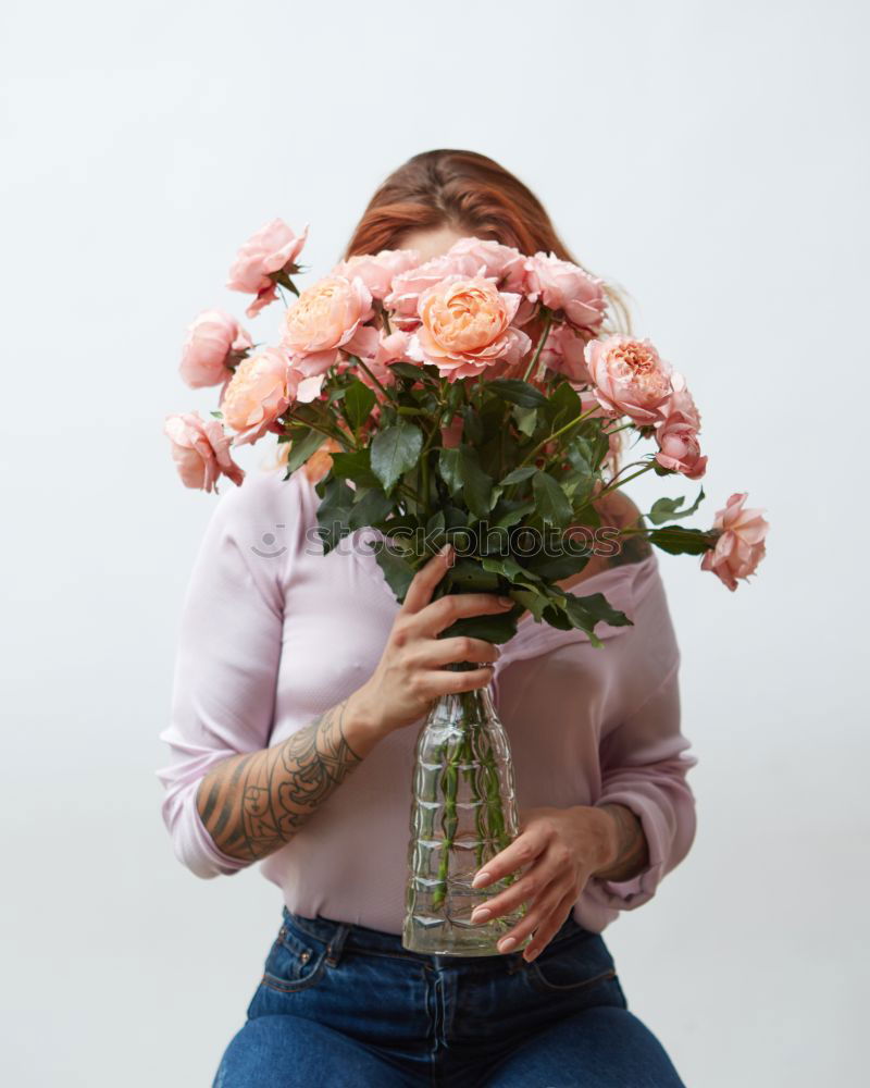 Similar – Foto Bild Junge Frau in einem hellblauen Kleid mit einem Blumenstrauß in der Hand.