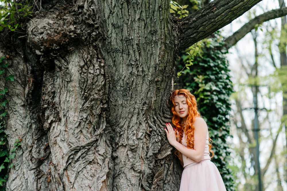 Similar – A Young Woman Standing in the Woods