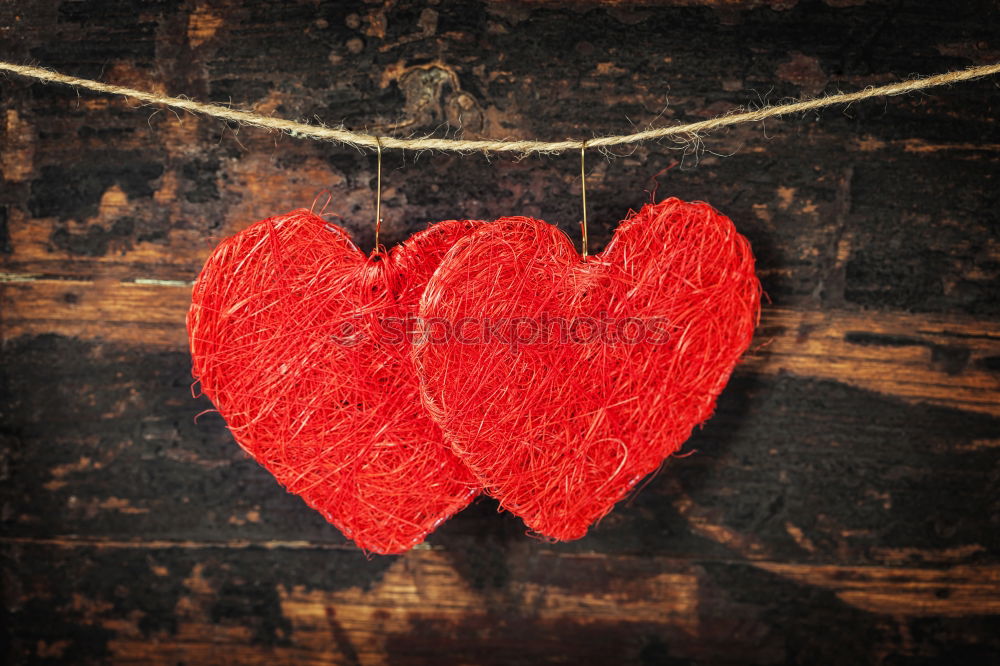 Similar – A red heart and LOVE are painted in gradient bright red color on a black wall / love