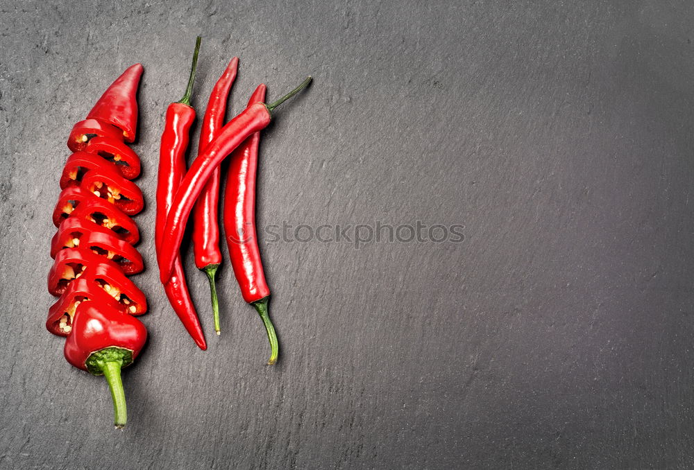 Similar – Rosemary, chopped chili and salt, wood background