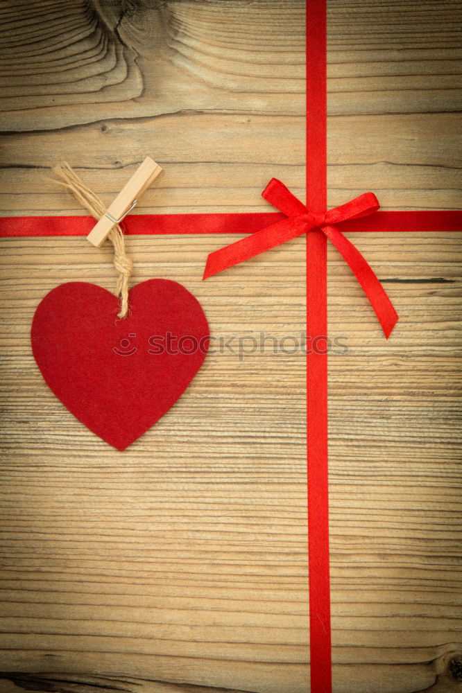 Similar – Beautiful gift with heart shape and red ribbon