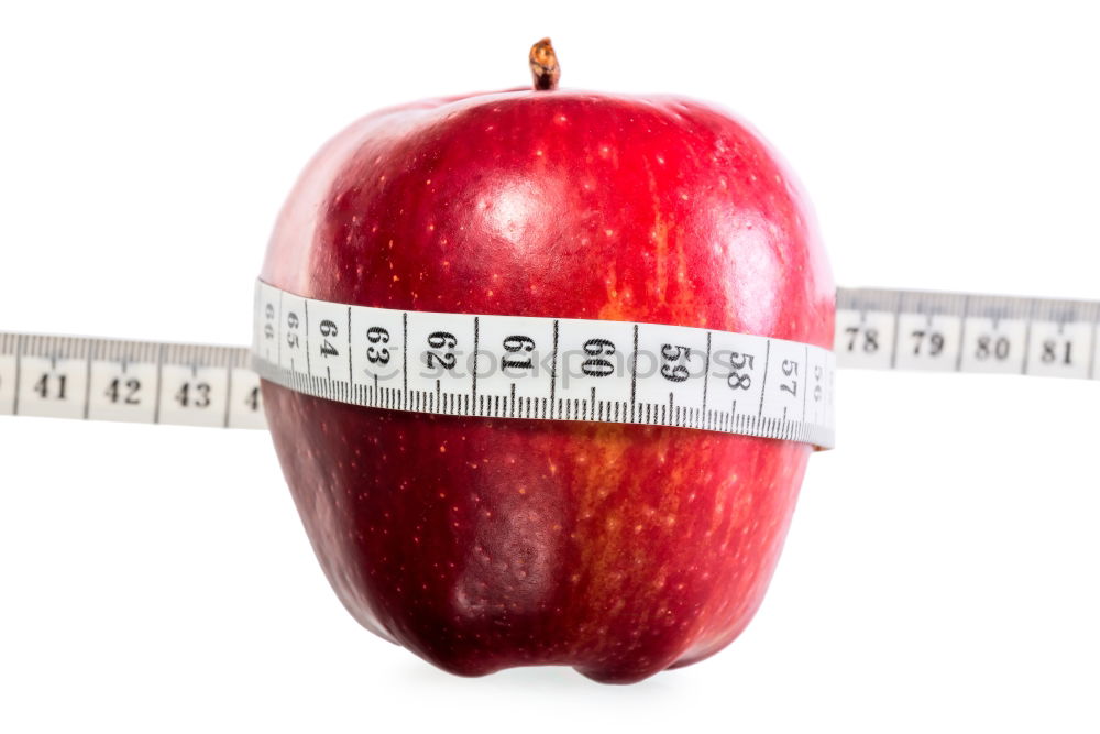 Similar – Red apple with a tape measure