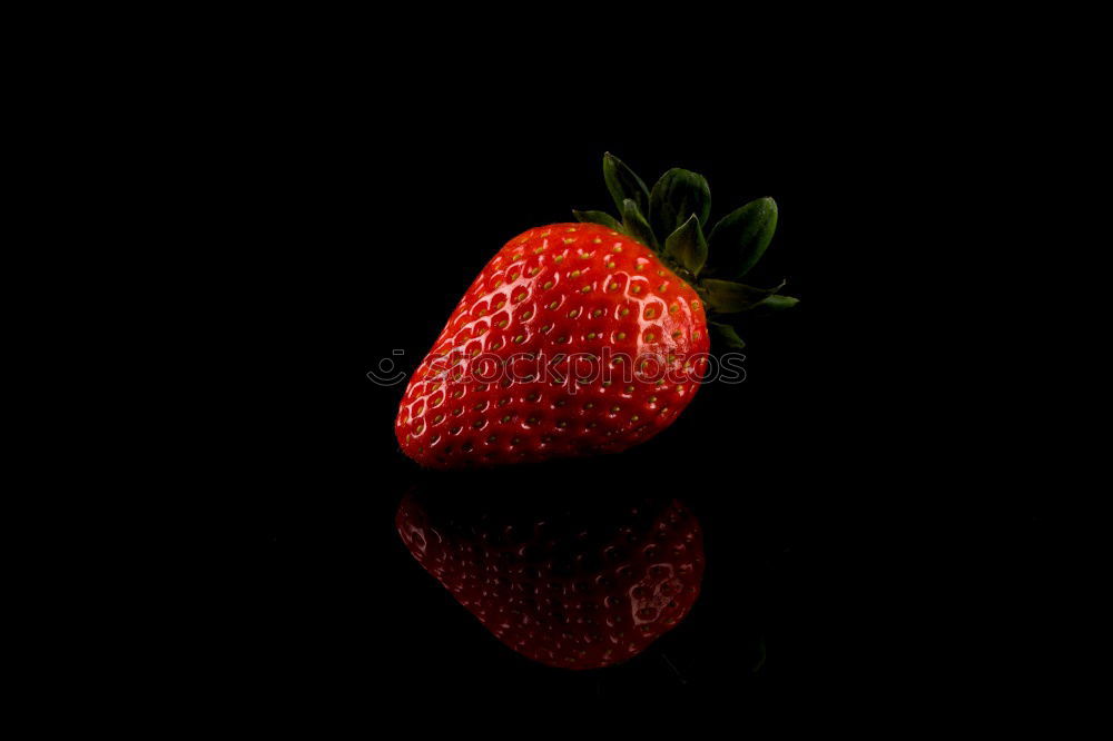 red juicy strawberry ripened in the sun