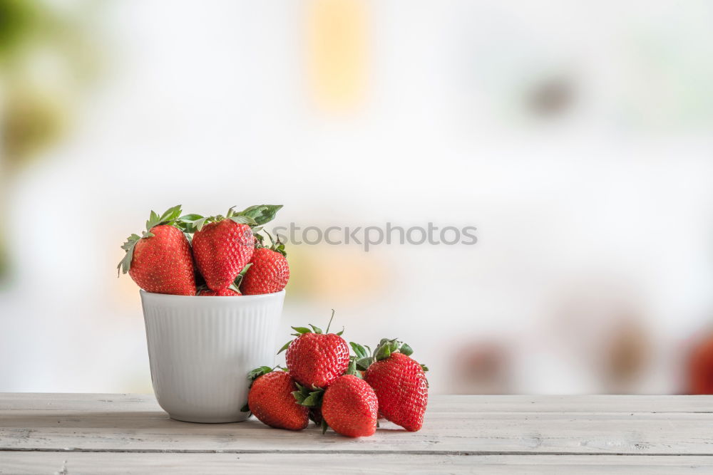 Similar – Strawberries in a bowl on a white wooden table