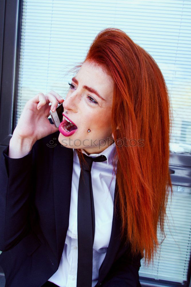 Redhead business woman with her blank calling card