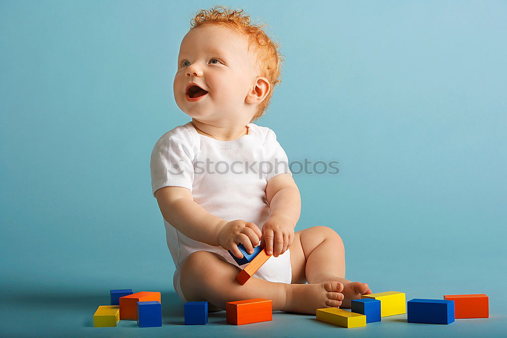 Similar – Image, Stock Photo Happy baby playing with toy blocks.