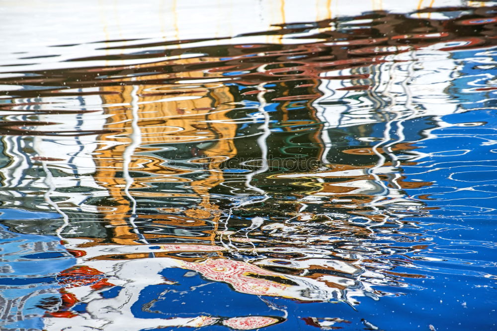 Similar – Rainwater on a blue garden table with reflection