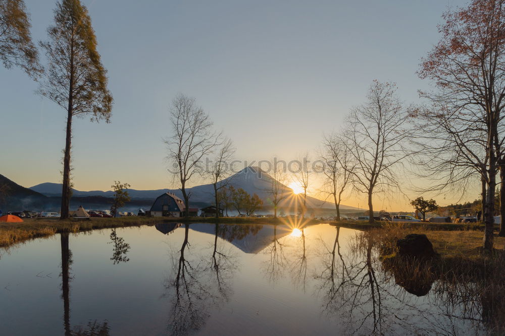 Similar – Alpine village under sun rays