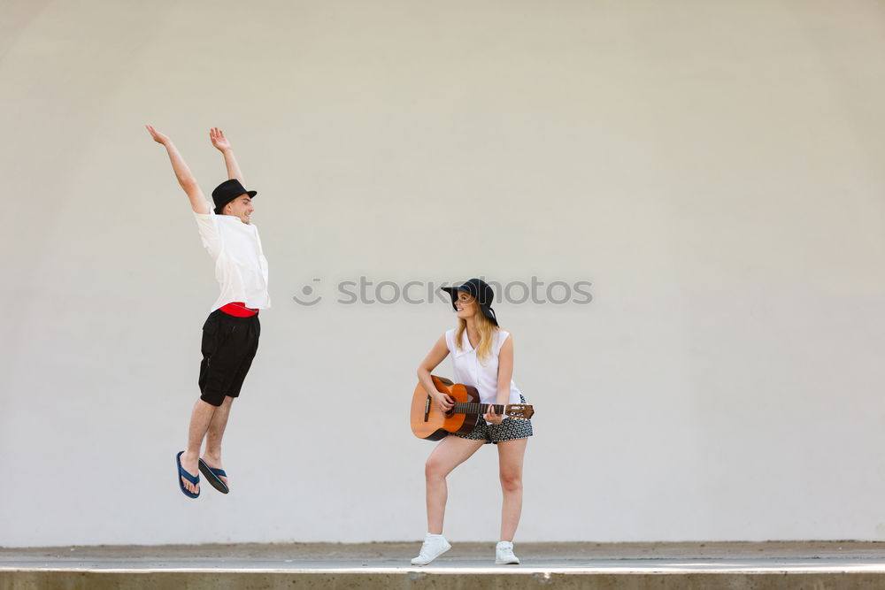 Similar – Cheerful women posing at fence