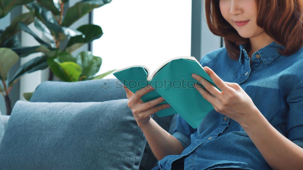 Similar – Young woman sitting on floor with notepad