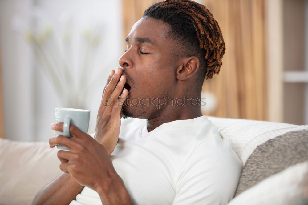 Similar – Image, Stock Photo Portrait of a young thoughtful mixed race man sitting in the sofa