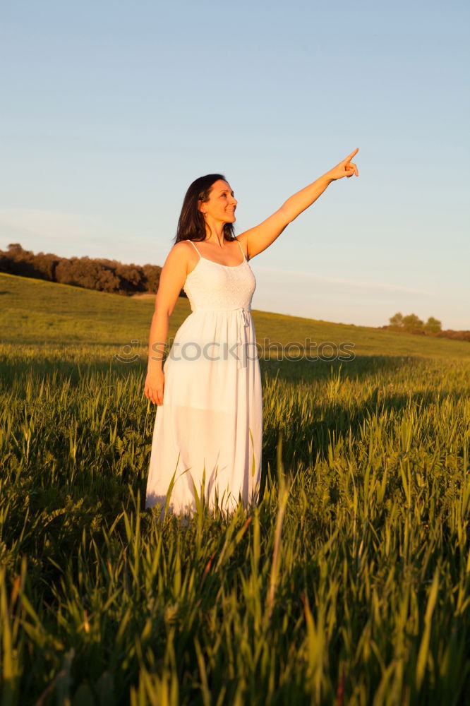 Similar – Image, Stock Photo Woman looking at side relaxing on a meadow