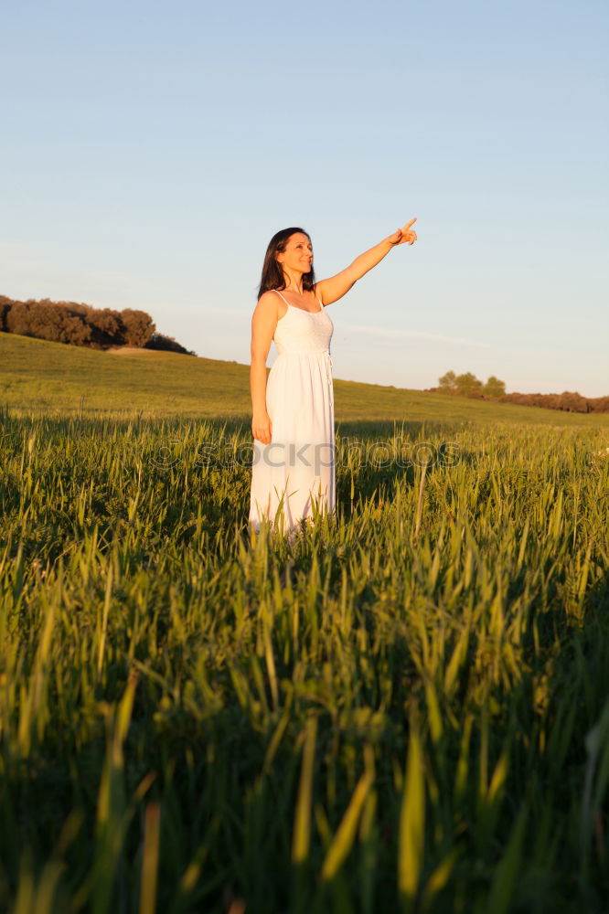 Image, Stock Photo Woman looking at side relaxing on a meadow