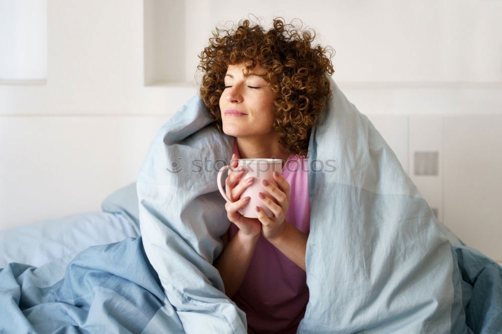 Similar – Pretty black woman covering her mouth with the sheet looking away