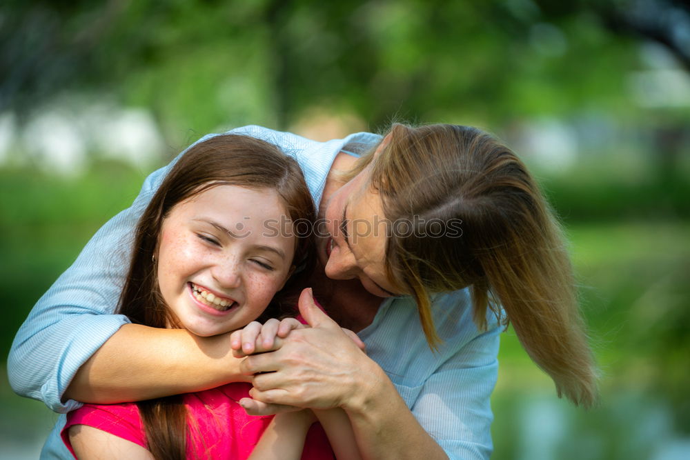 Similar – Baby girl standing on a bench hugging to woman